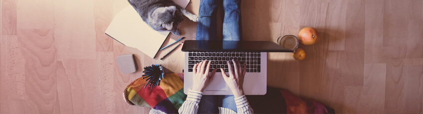 Photo of person working on notebook computer